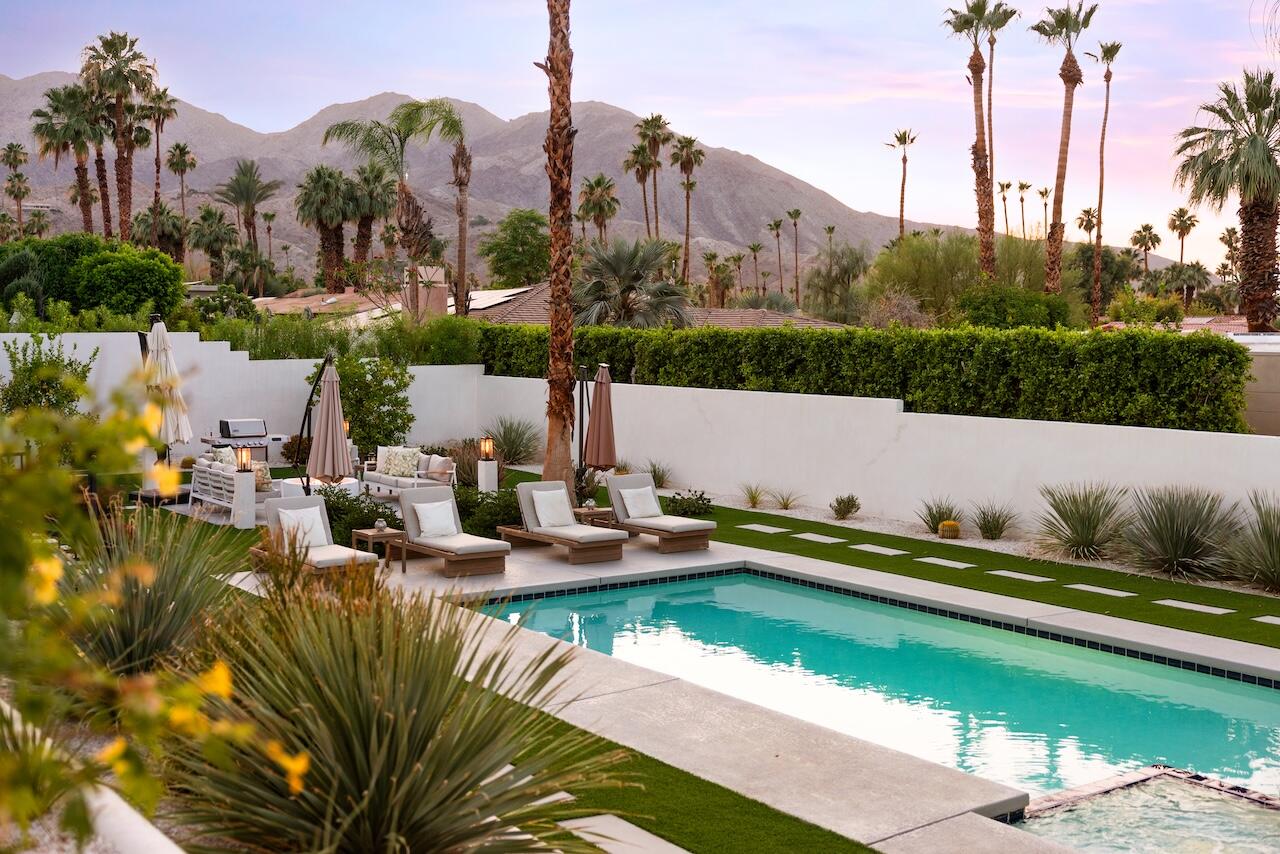 72870 Bel Air Road, Unit 4 Palm Desert, CA 92260 - Photo 31 of 36 a view of swimming pool with outdoor seating and city view