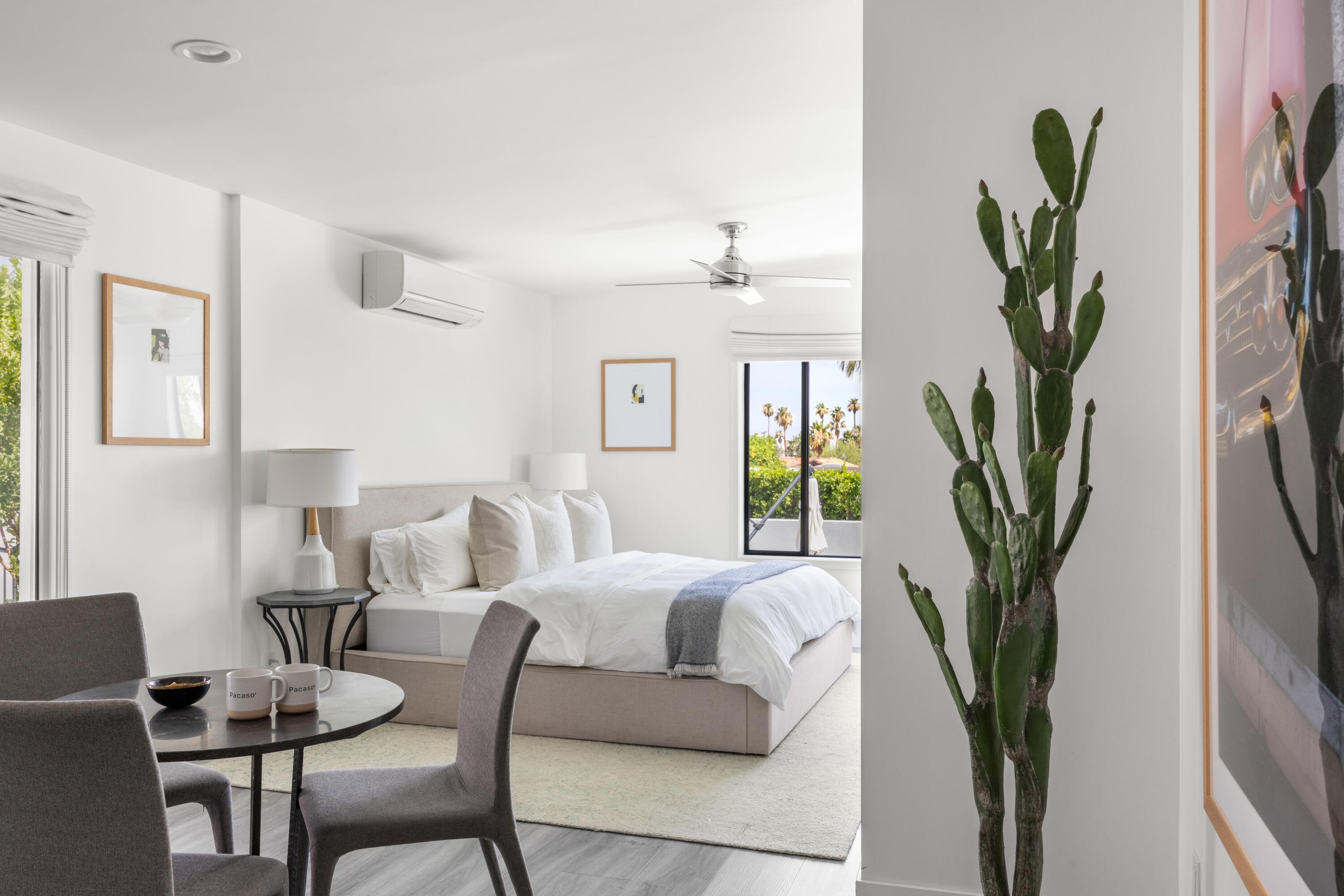 72870 Bel Air Road, Unit 4 Palm Desert, CA 92260 - Photo 8 of 36 a living room with furniture a potted plant and a wooden floor