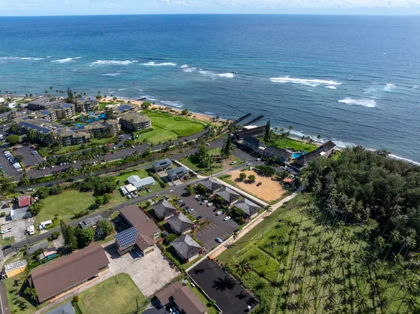 an aerial view of residential houses with outdoor space