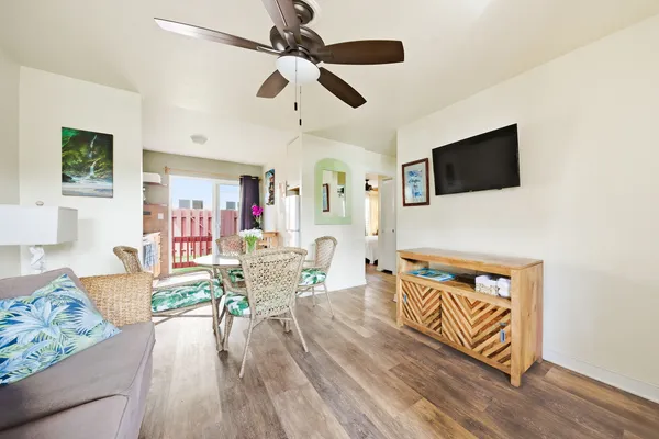 a living room with furniture and a flat screen tv