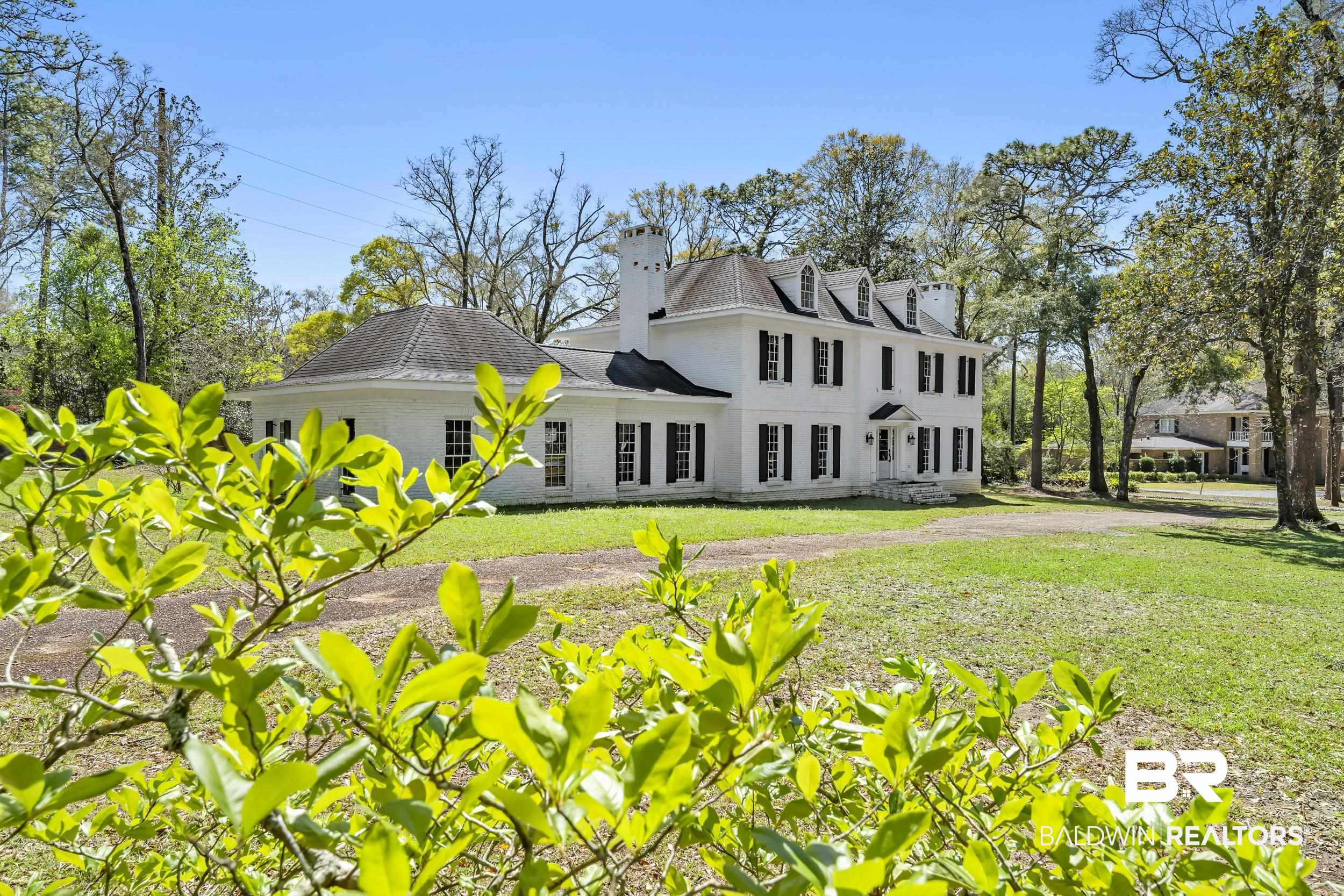 5801 South Fairfax Road Mobile, AL 36608 - Photo 4 of 29 View of front facade with a chimney, a front lawn, and brick siding