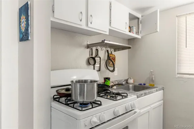 a white refrigerator freezer sitting inside of a kitchen