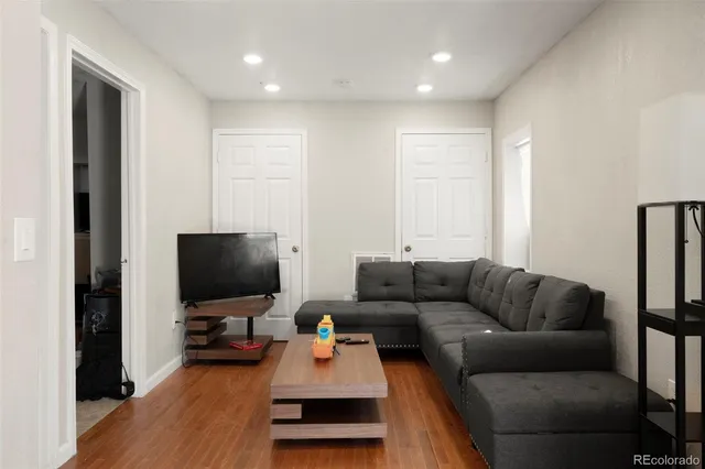 a kitchen with refrigerator and cabinets