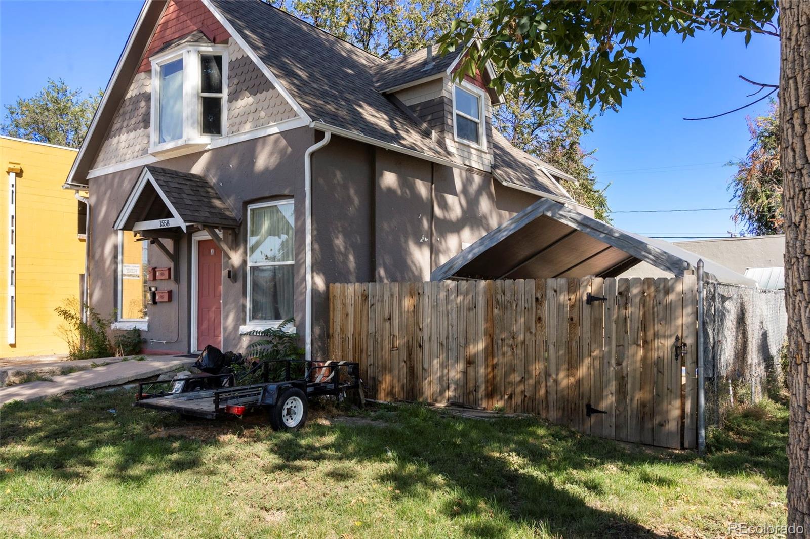 1558 Dallas Street Aurora, CO 80010 - Photo 23 of 24 a view of a house with backyard and sitting area