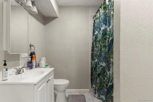 a bathroom with a sink and a bath tub