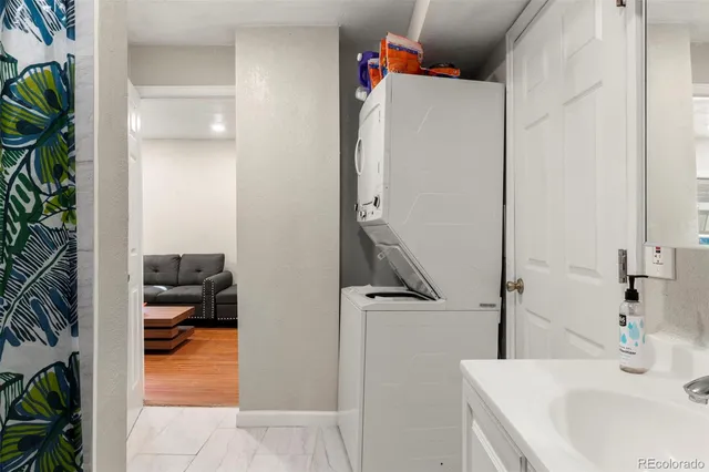 a kitchen with stainless steel appliances a refrigerator sink and cabinets