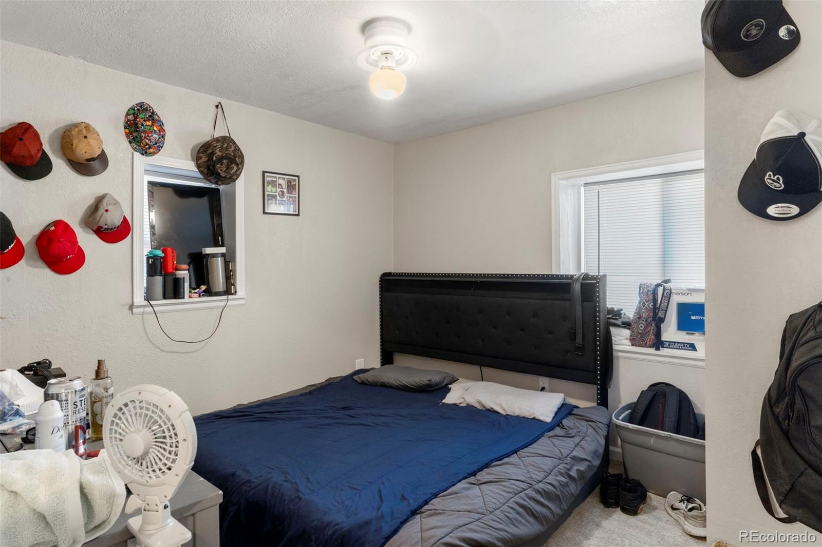 1558 Dallas Street Aurora, CO 80010 - Photo 9 of 24 a living room with furniture and a flat screen tv