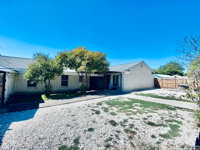a house view with a backyard space