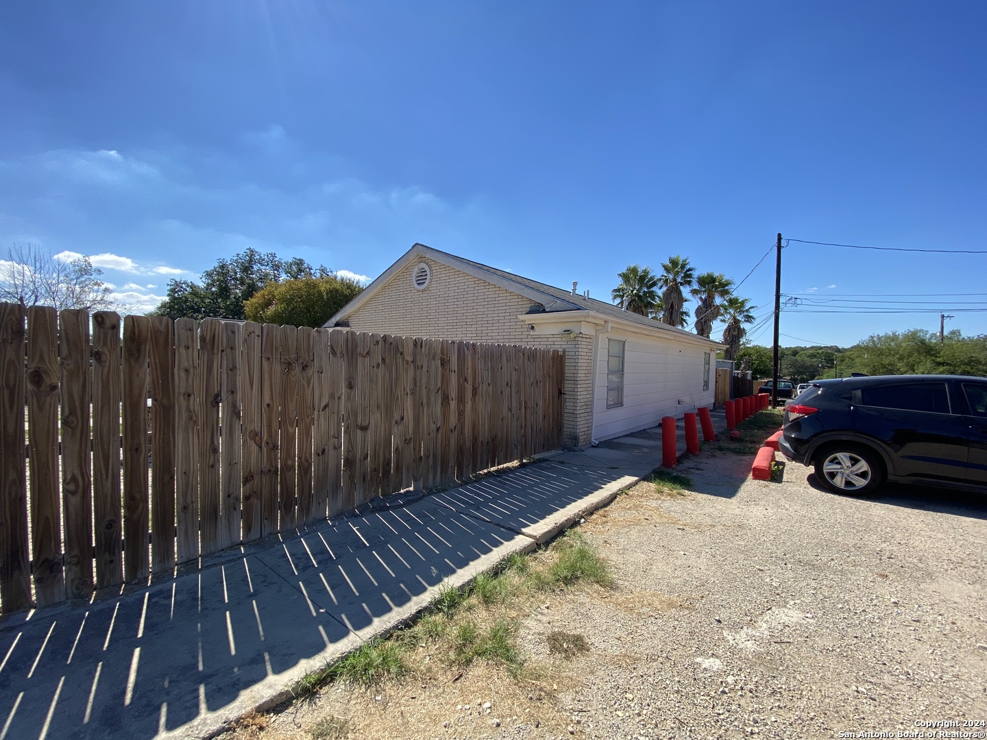 3915 Sherril Brook Road, Unit 4 San Antonio, TX 78228 - Photo 3 of 6 a view of a house with wooden fence