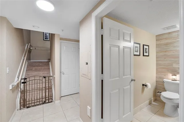 a bathroom with a toilet a sink and a mirror