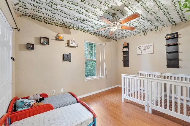 a bedroom with furniture and a window