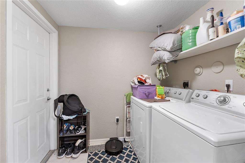 6926 West Sample Road, Unit 6926 Coral Springs, FL 33067 - Photo 24 of 41 a utility room with dryer and washer