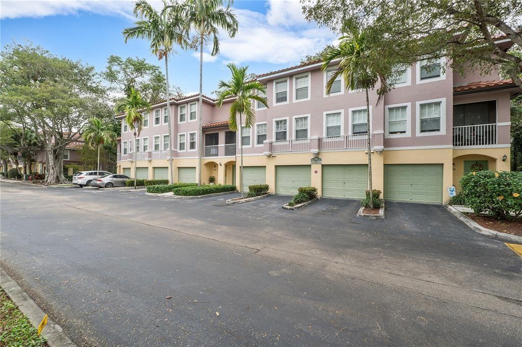 6926 West Sample Road, Unit 6926 Coral Springs, FL 33067 - Photo 27 of 41 a view of a street with a building in the background