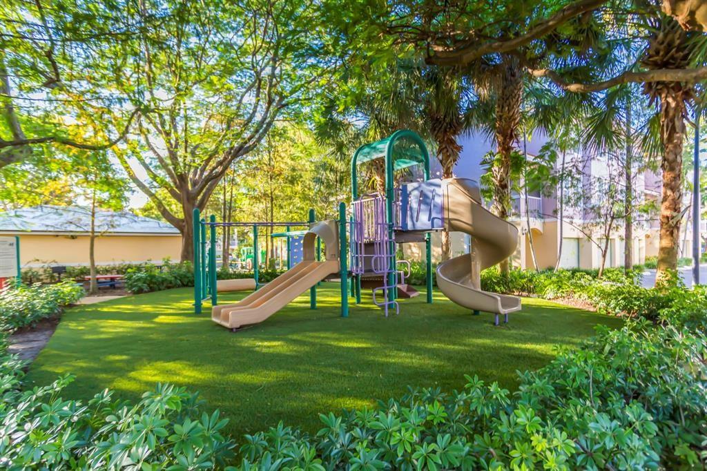 6926 West Sample Road, Unit 6926 Coral Springs, FL 33067 - Photo 30 of 41 a view of a house with a yard and sitting area
