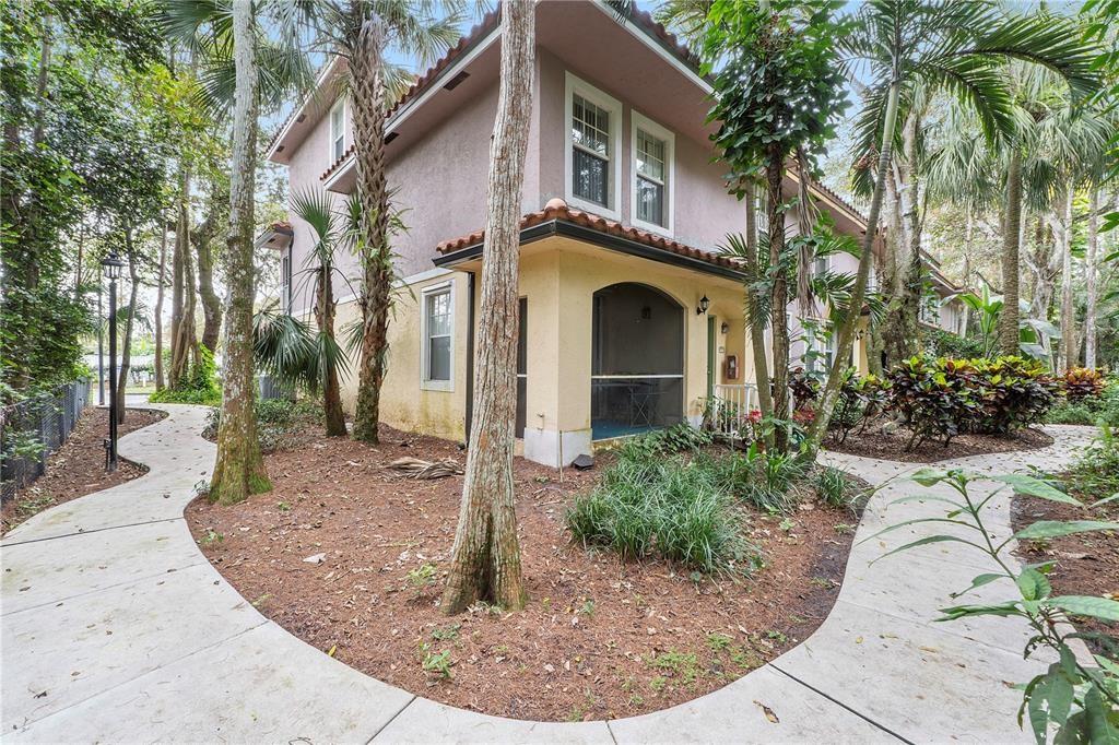 6926 West Sample Road, Unit 6926 Coral Springs, FL 33067 - Photo 3 of 41 a front view of a house with garden
