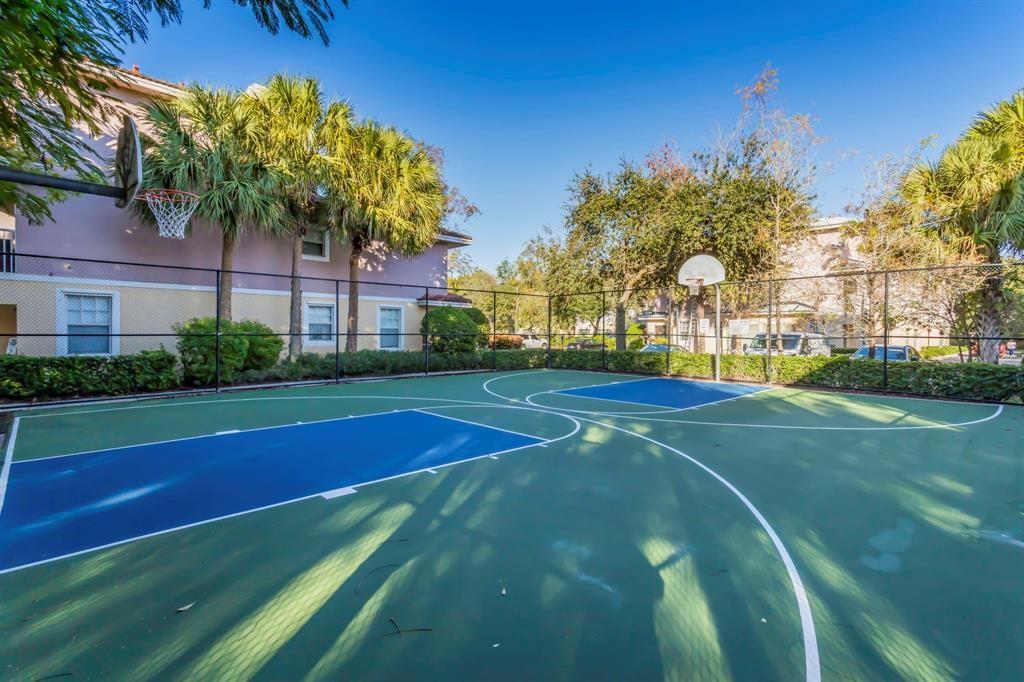 6926 West Sample Road, Unit 6926 Coral Springs, FL 33067 - Photo 31 of 41 a view of a tennis court