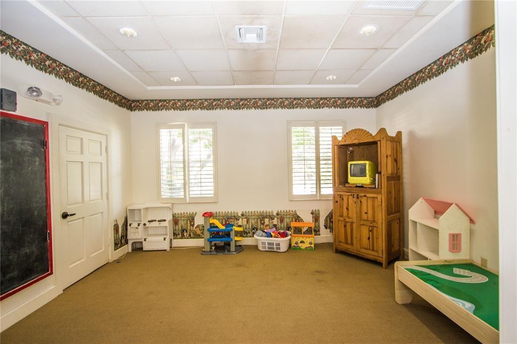 6926 West Sample Road, Unit 6926 Coral Springs, FL 33067 - Photo 39 of 41 a spacious bedroom with a bed and a couch