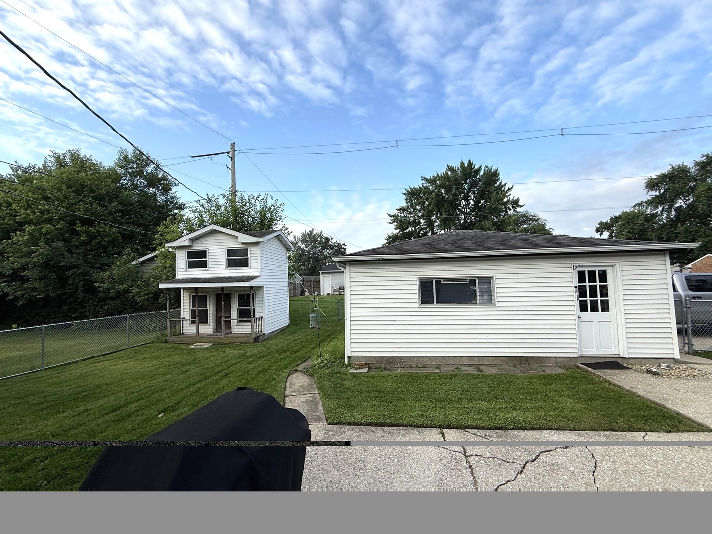 5199 Elmwood Road Oak Forest, IL 60452 - Photo 27 of 30 a front view of a house with a yard