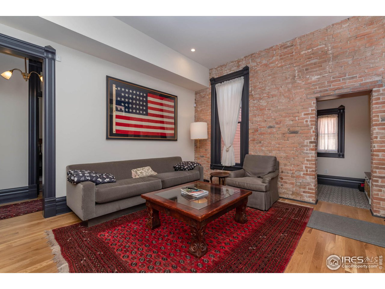 1507 Pine Street Boulder, CO 80302 - Photo 11 of 28 a living room with furniture and a wooden floor
