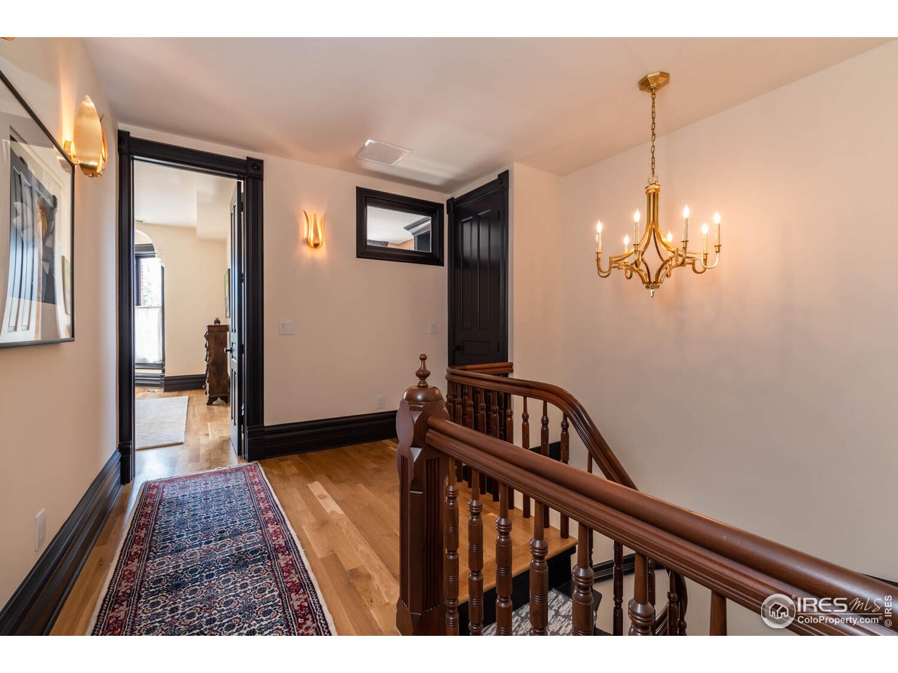 1507 Pine Street Boulder, CO 80302 - Photo 14 of 28 a view of a hallway with a chandelier