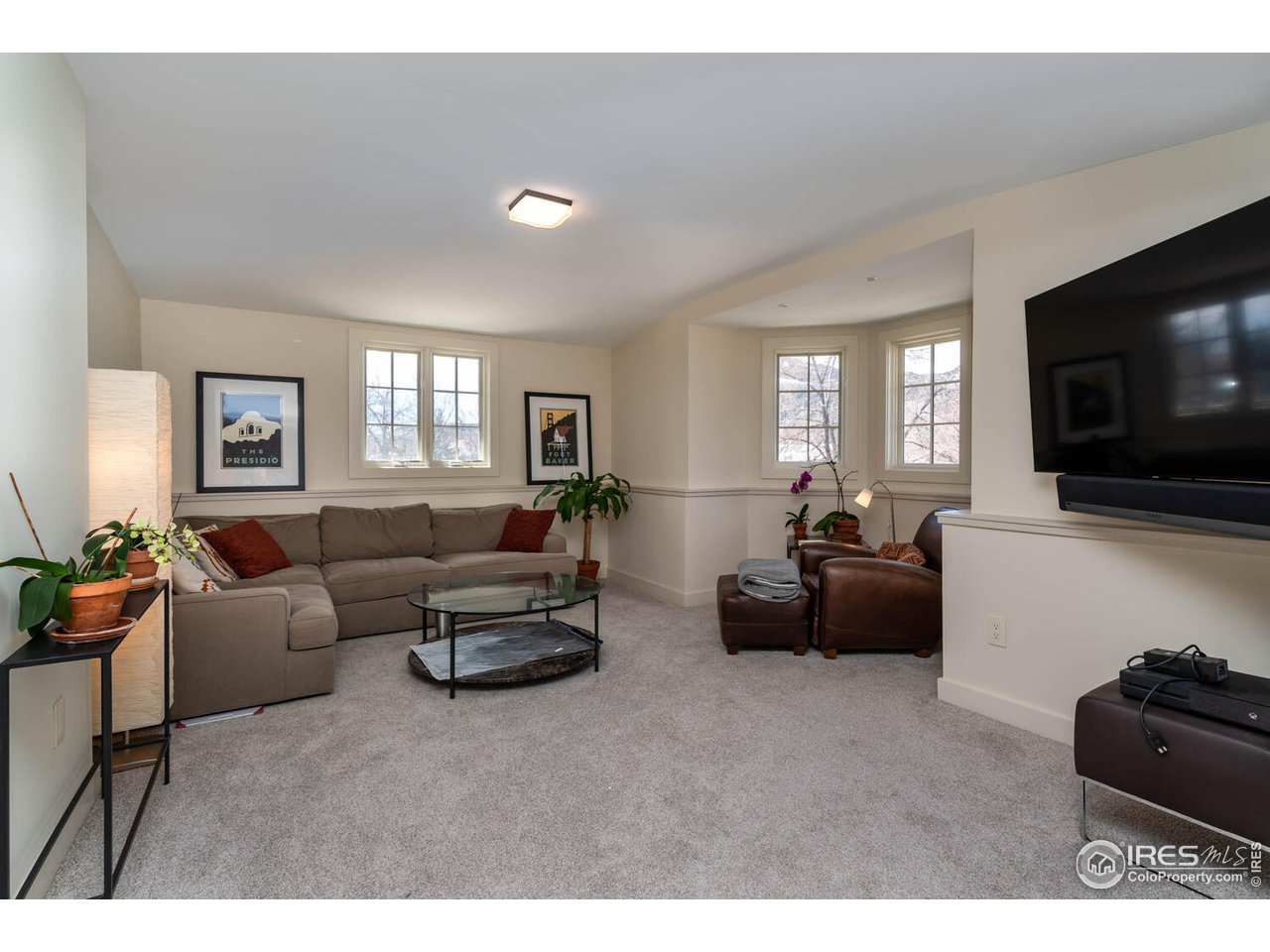 1507 Pine Street Boulder, CO 80302 - Photo 26 of 28 a living room with furniture and a flat screen tv