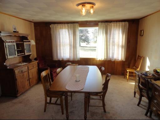 8884 Highway 251 Rochelle, IL 61068 - Photo 4 of 8 a view of a dining room with furniture window and outside view