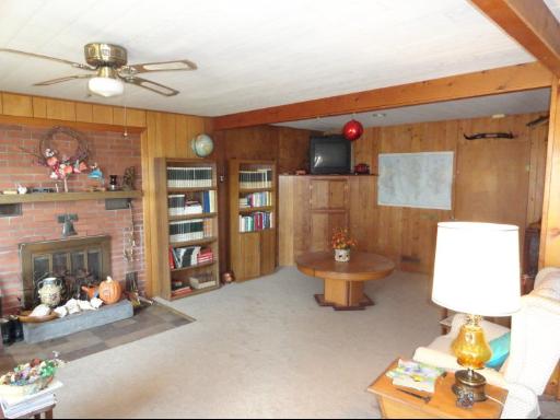 8884 Highway 251 Rochelle, IL 61068 - Photo 5 of 8 a living room with furniture and flowers