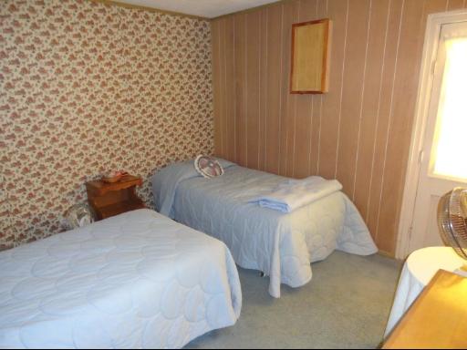 8884 Highway 251 Rochelle, IL 61068 - Photo 8 of 8 a bedroom with bed and a lamp
