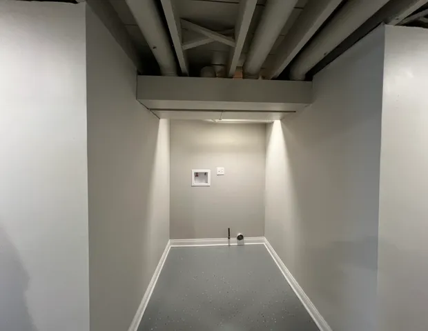 a view of a room with wooden walls