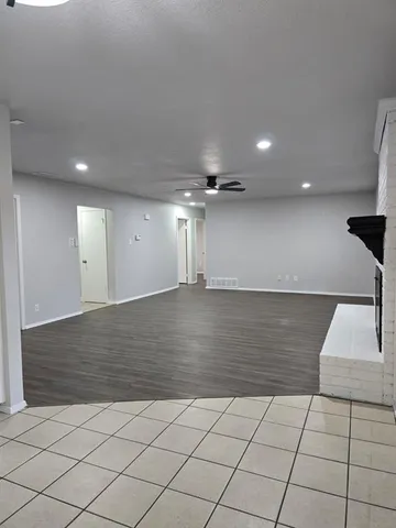 an empty room with wooden floor