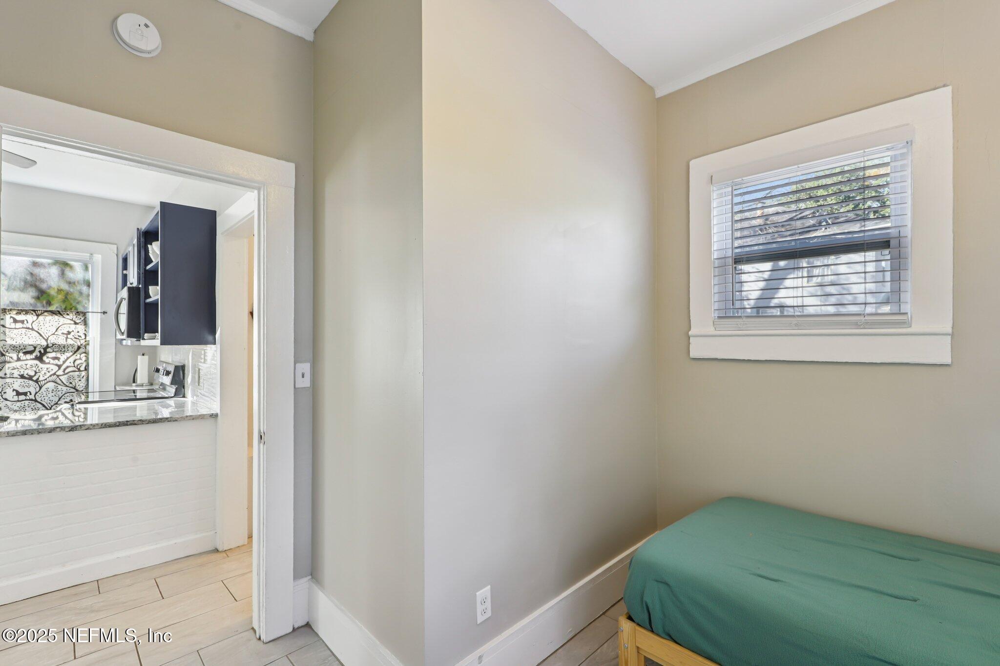 646 Day Avenue Jacksonville, FL 32205 - Photo 17 of 27 a view of a hallway that has a bed and a dresser