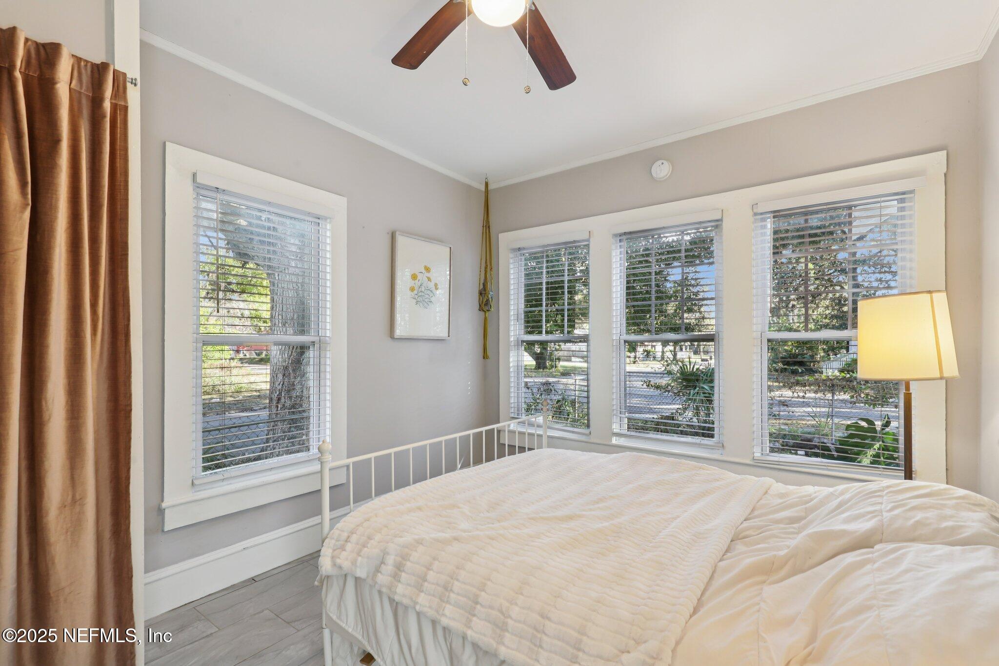 646 Day Avenue Jacksonville, FL 32205 - Photo 20 of 27 a bedroom with a large bed and a large window