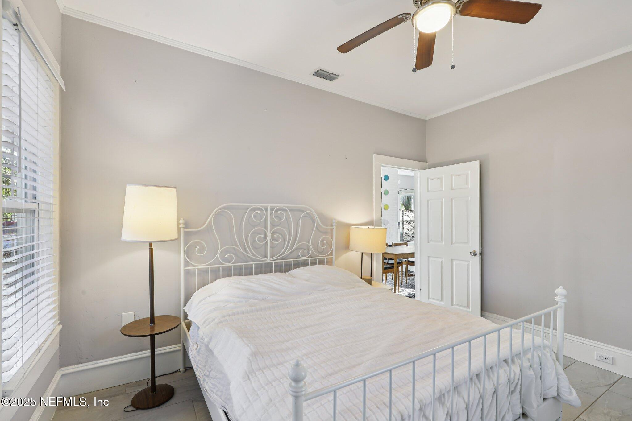 646 Day Avenue Jacksonville, FL 32205 - Photo 21 of 27 a bedroom with a bed and a lamp