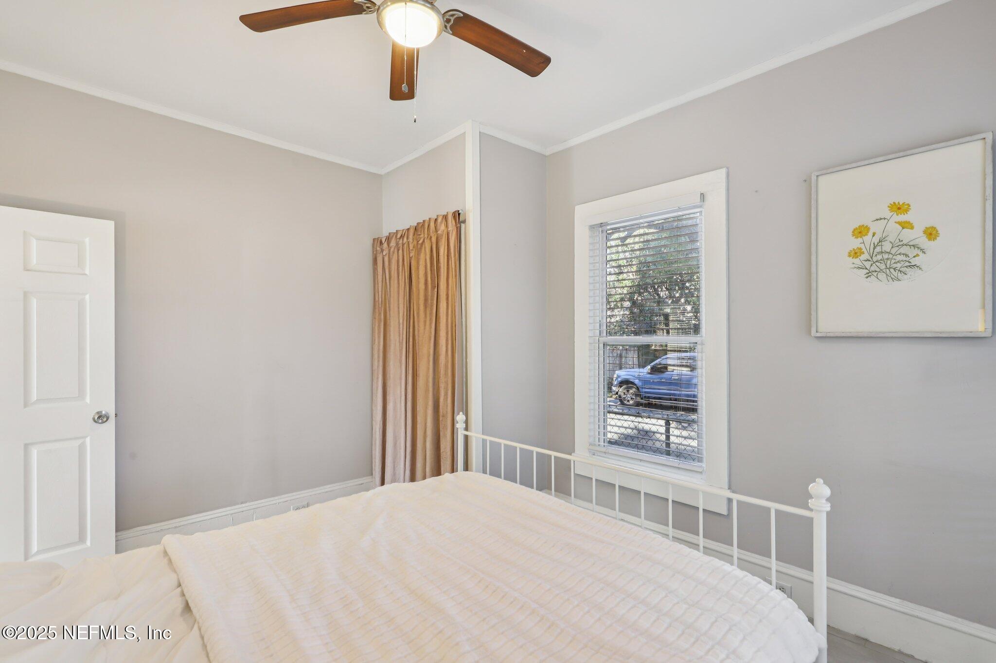 646 Day Avenue Jacksonville, FL 32205 - Photo 22 of 27 a bedroom with a bed and a window