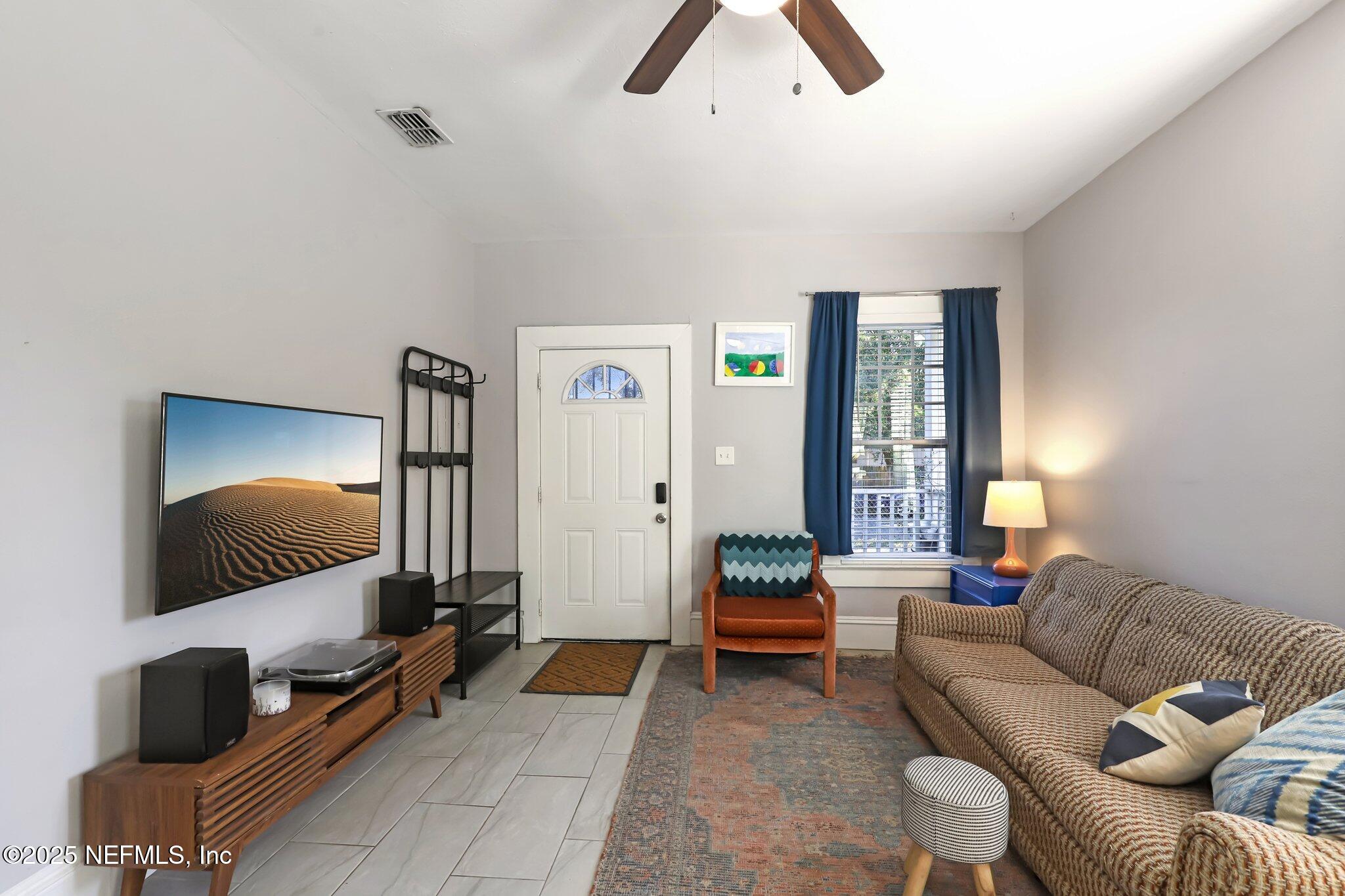 646 Day Avenue Jacksonville, FL 32205 - Photo 4 of 27 a living room with furniture and a flat screen tv