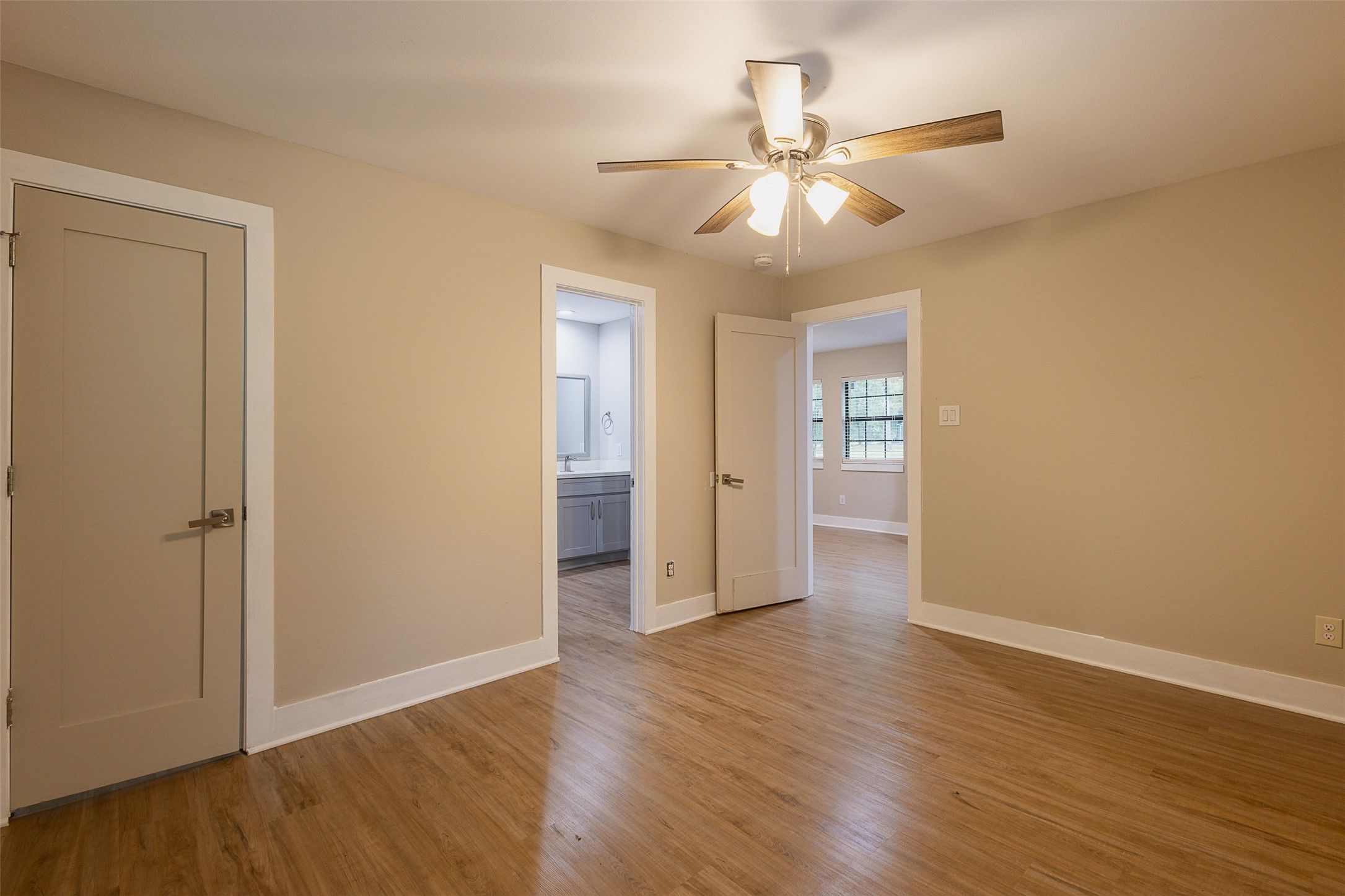 12028 Cedar Lane Conroe, TX 77303 - Photo 12 of 41 a view of an empty room with wooden floor