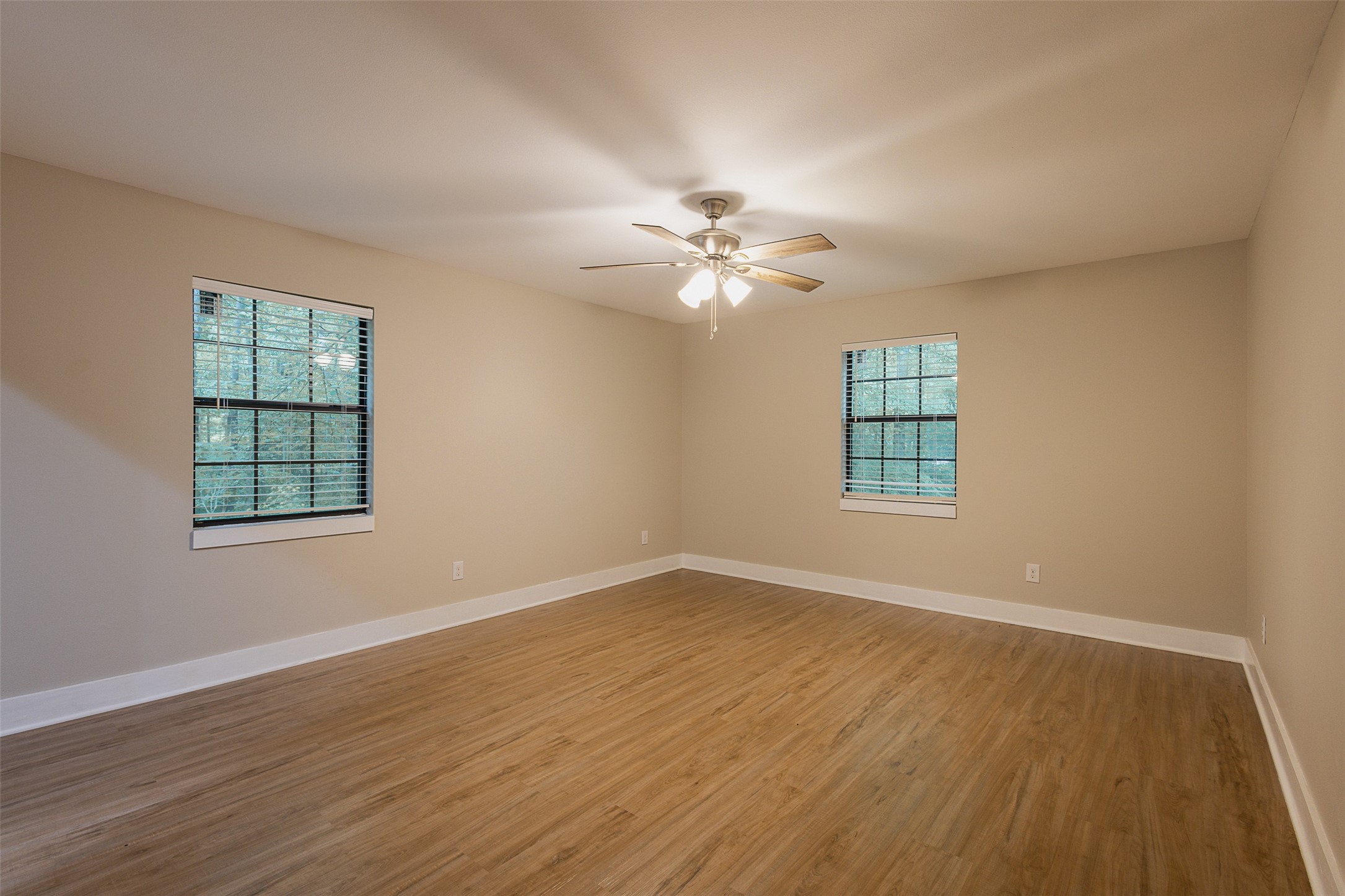 12028 Cedar Lane Conroe, TX 77303 - Photo 19 of 41 wooden floor in an empty room with a window