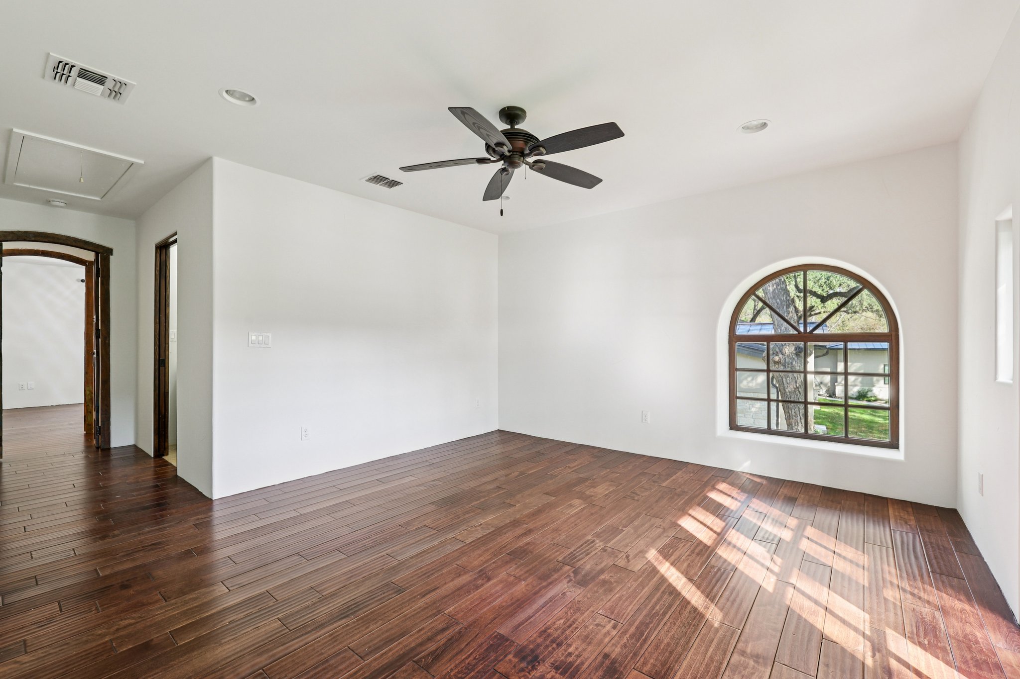 2706 Pearce Road Austin, TX 78730 - Photo 21 of 38 wooden floor in an empty room with a window