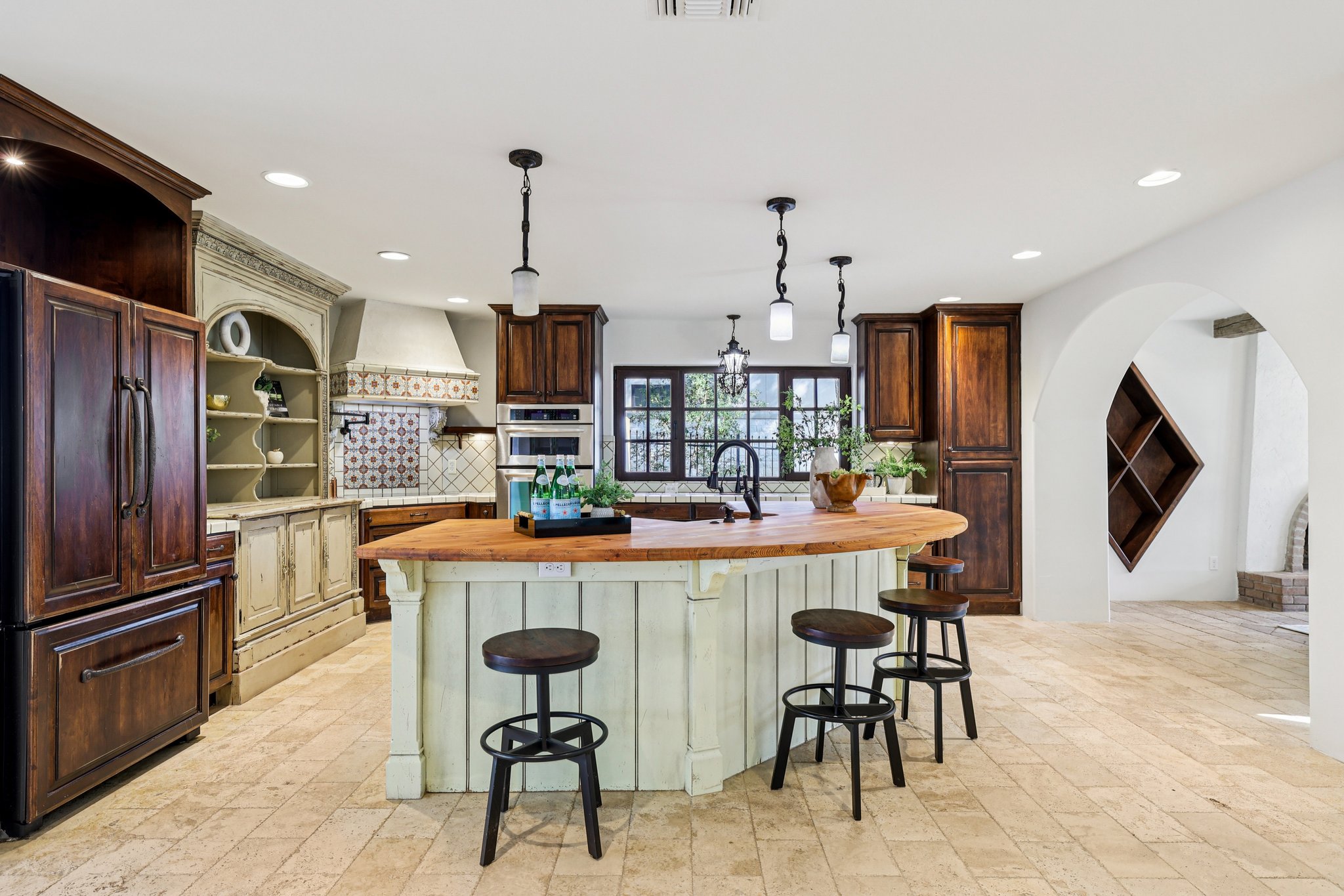 2706 Pearce Road Austin, TX 78730 - Photo 6 of 38 a kitchen with refrigerator and chairs