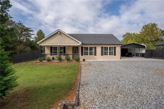 a front view of a house with garden