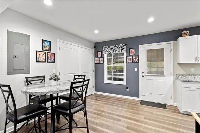 a view of a dining room with furniture window and wooden floor