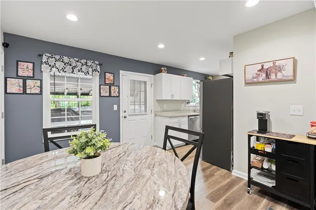 a room with furniture and a potted plant