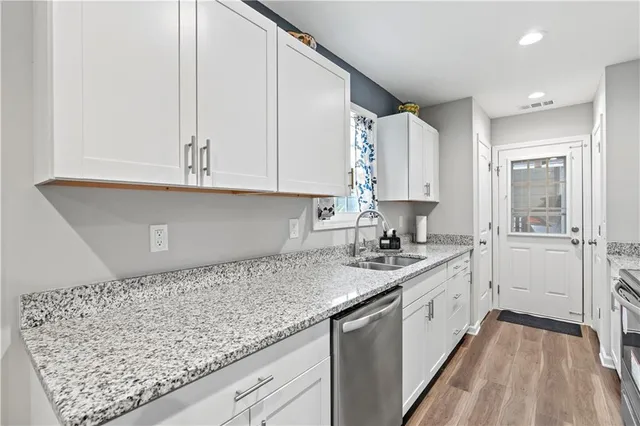 a kitchen with a sink and cabinets