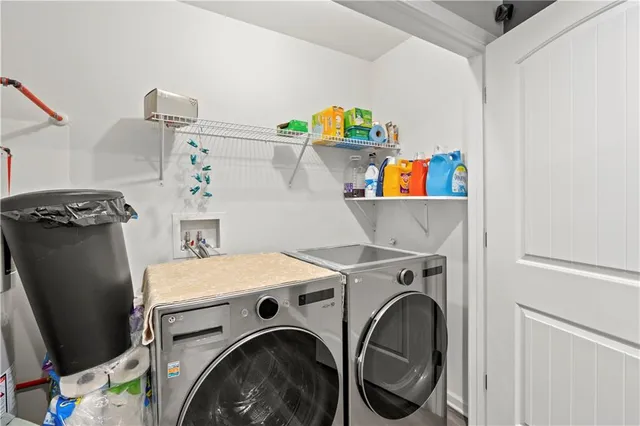 a utility room with dryer and washer