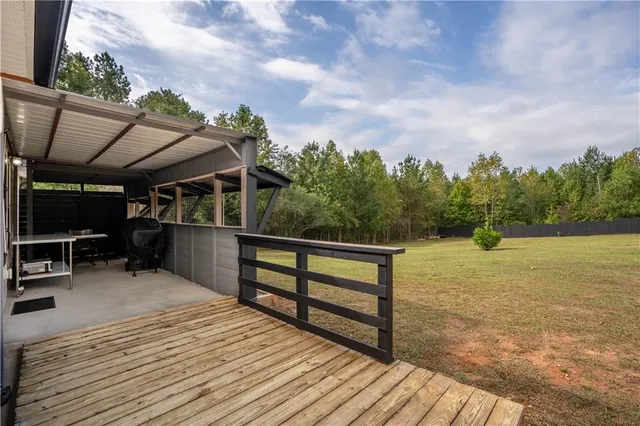 a view of a terrace with wooden floor and outdoor space