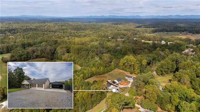 an aerial view of residential house with swimming pool