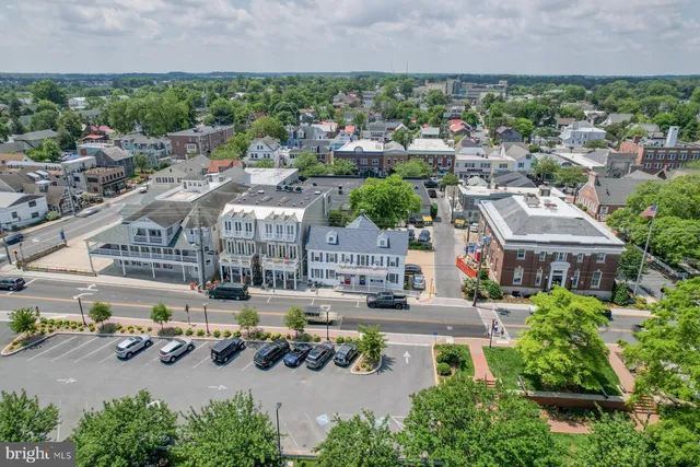 an aerial view of a house with yard swimming pool and outdoor seating