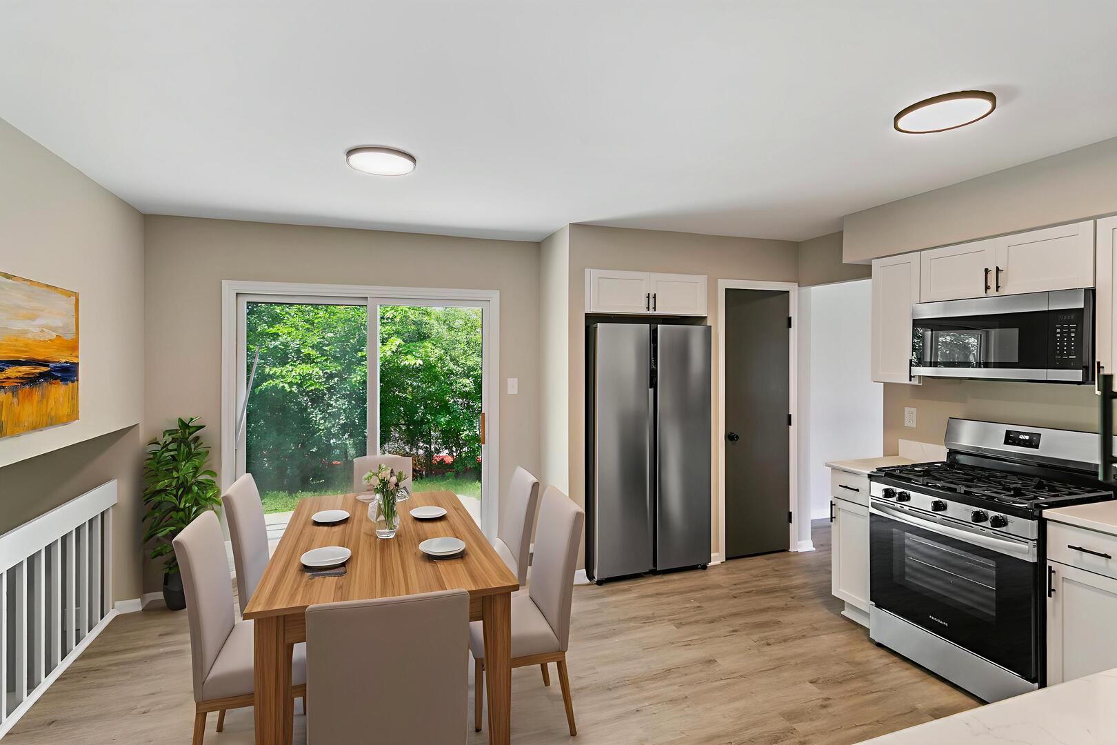 3518 Jacqueline Drive Crete, IL 60417 - Photo 6 of 23 a kitchen with stainless steel appliances a stove a sink dishwasher a refrigerator with a dining table and chairs