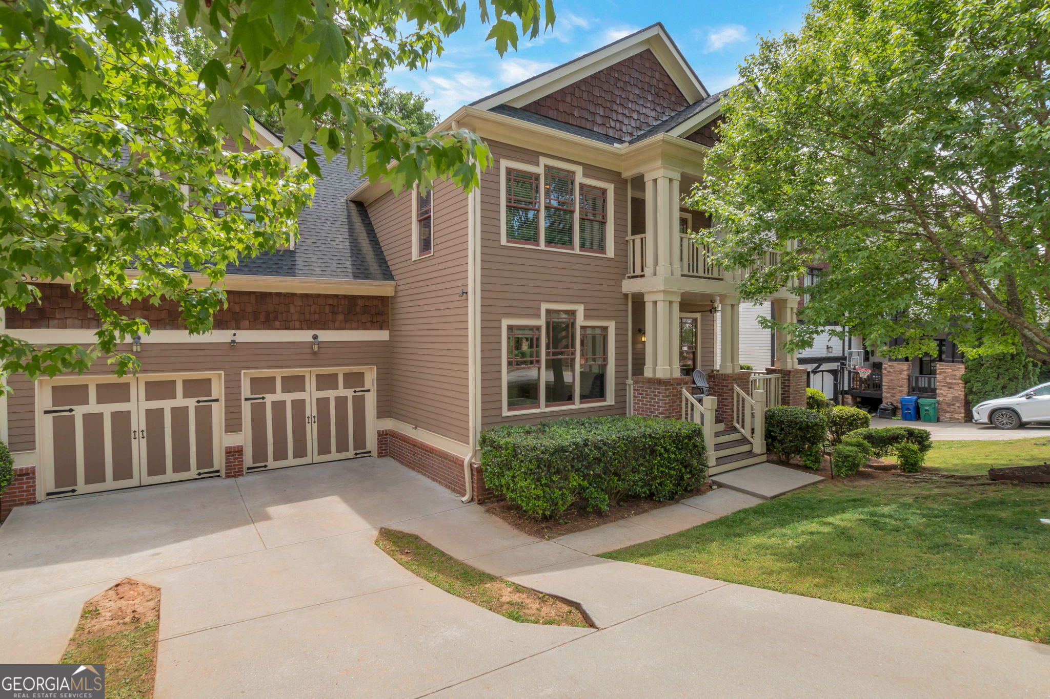 a front view of a house with garden