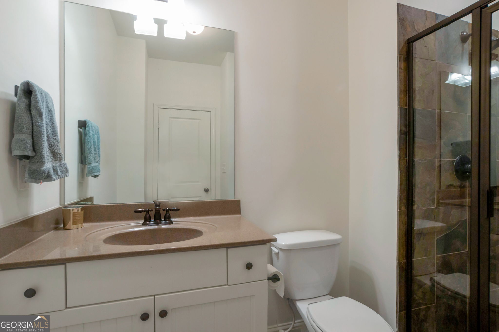 2524 Kickerillo Way Southeast Atlanta, GA 30316 - Photo 13 of 50 a bathroom with a sink toilet and shower